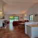 Bright high ceiling livingroom with dbl doors to private pool